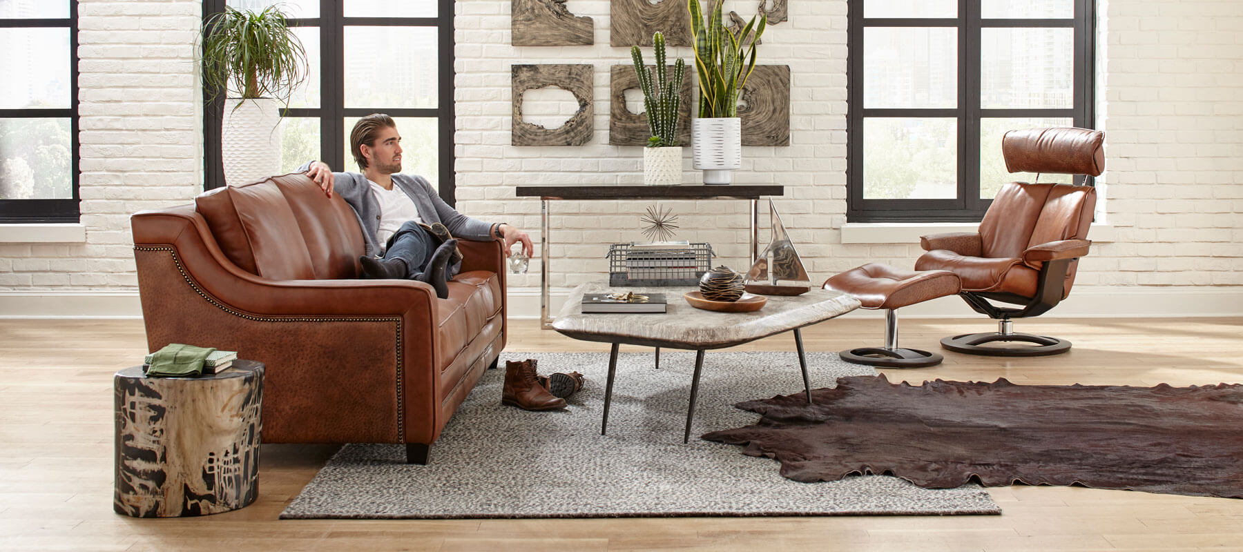 Man Sitting On Leather Furniture sold by Hayek's Leather Furniture